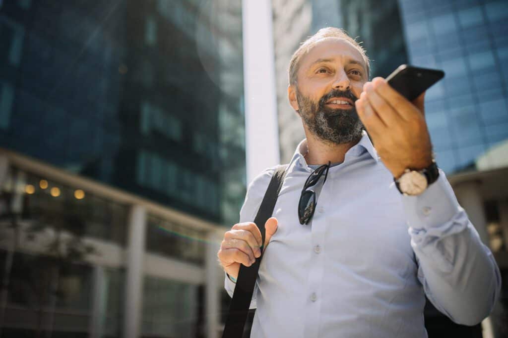 man walking while talking on the phone