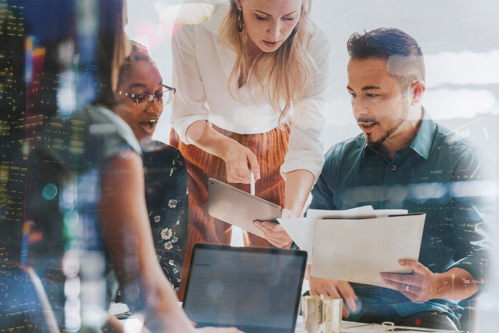 people in marketing planning some work together